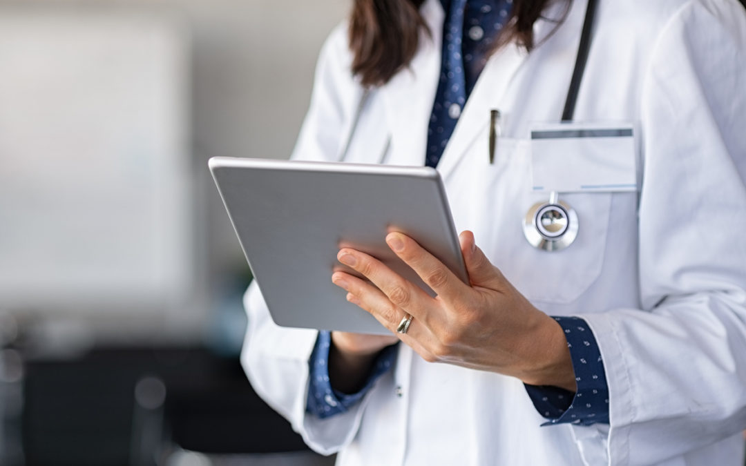 Doctor using digital tablet